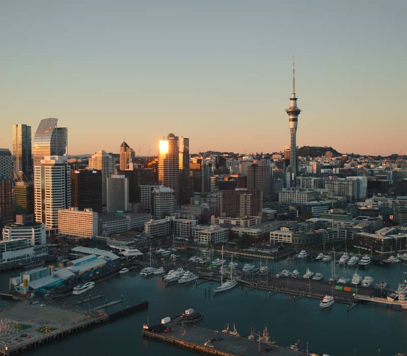 Aerial view of Auckland skyline with Sky Tower at dusk